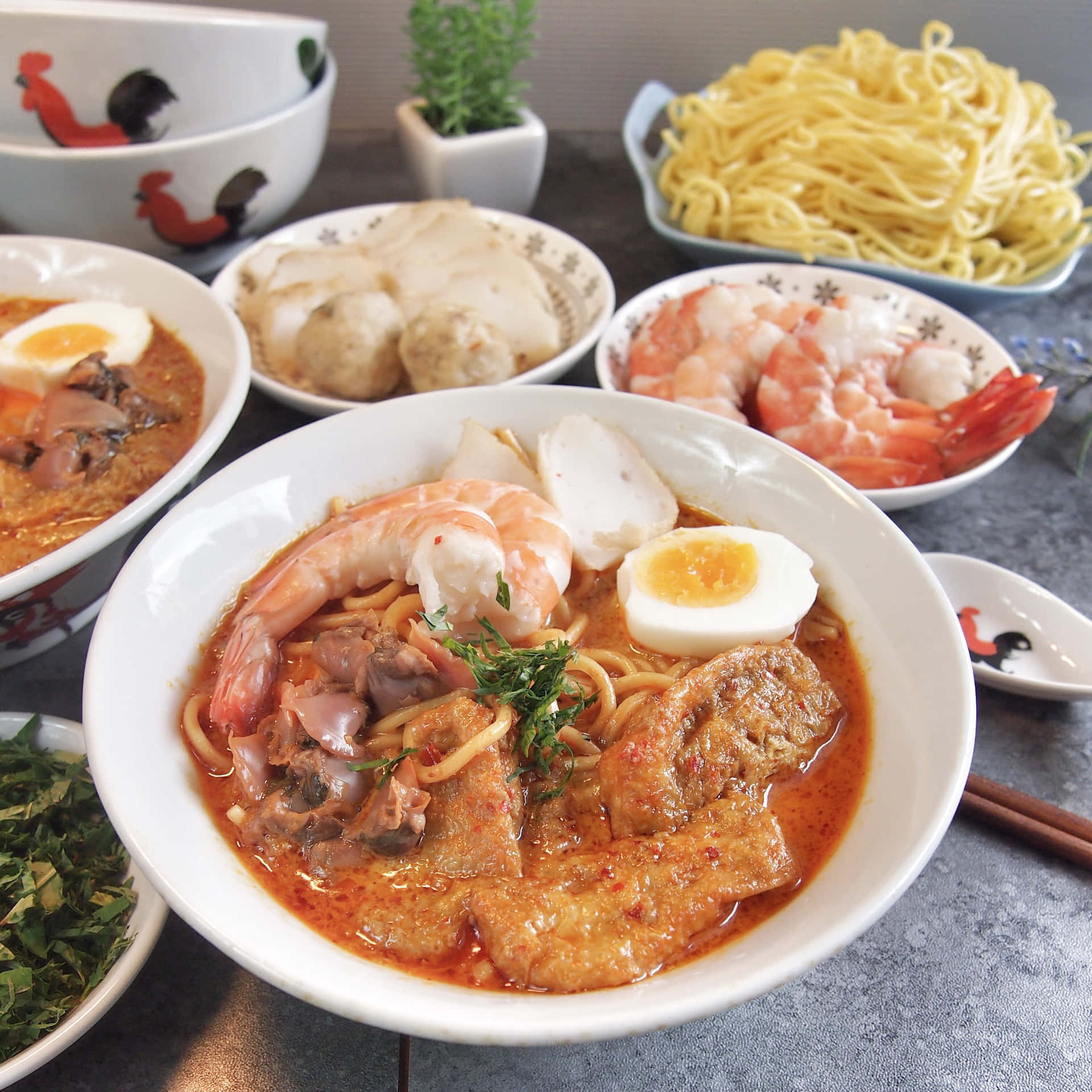 A Delicious Bowl Of Curry Laksa Surrounded By Fresh Ingredients Background