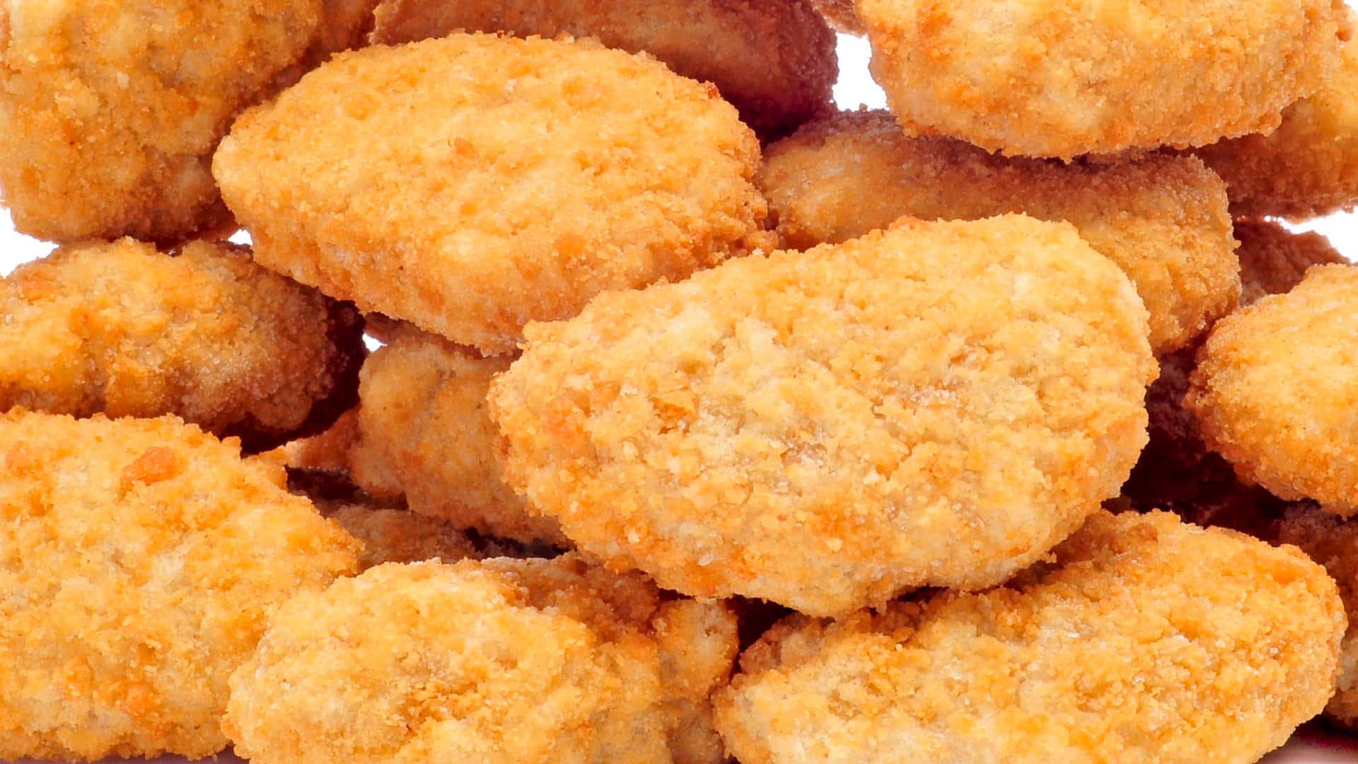 A Delicious Plate Of Golden Fried Chicken Nuggets.