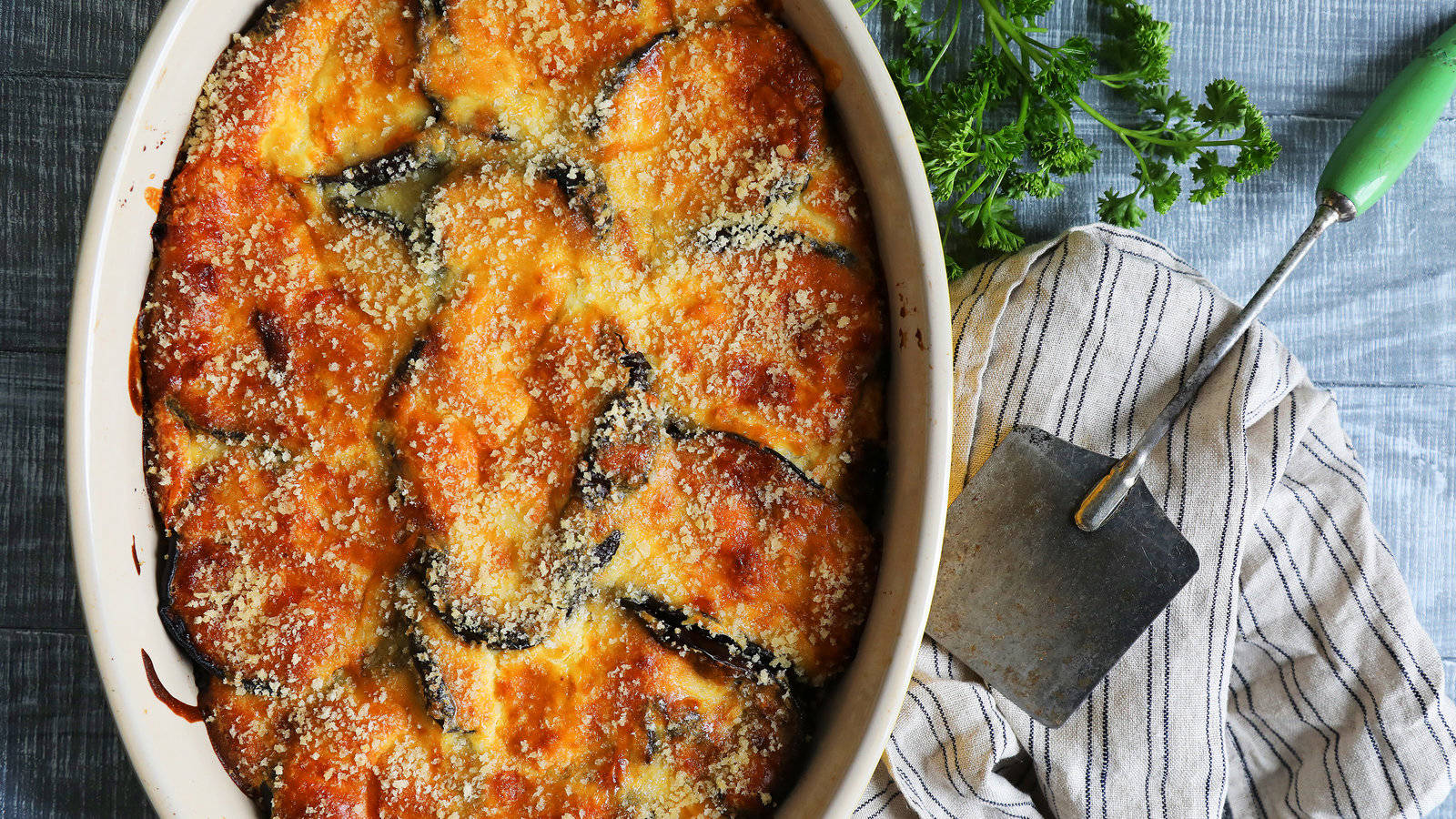 A Delicious Tray Of Moussaka Ready To Serve Background