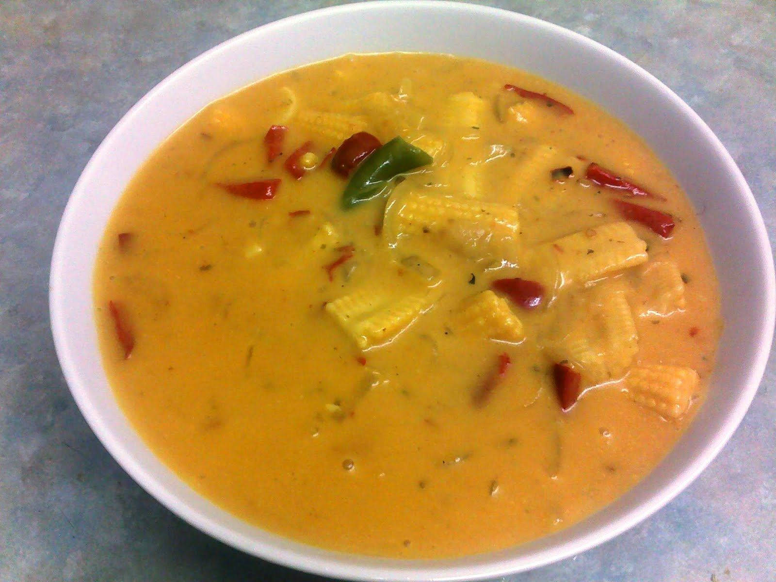 A Delightful Dish Of Yellow Curry With Fresh Baby Corn Background