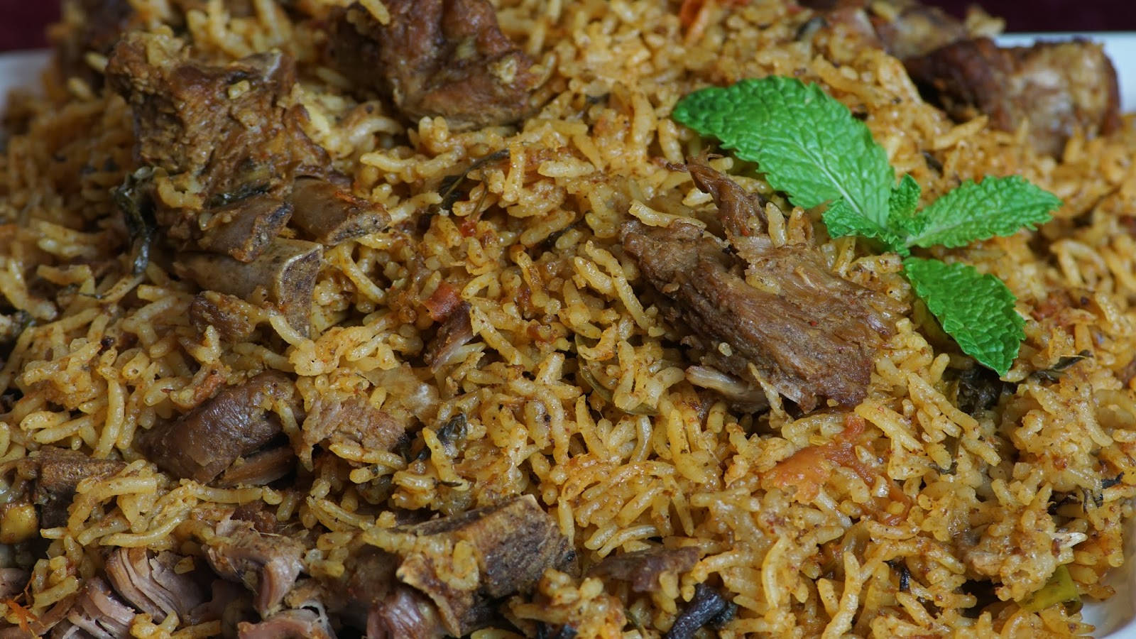 A Delightful Plate Of Beef Biryani Background