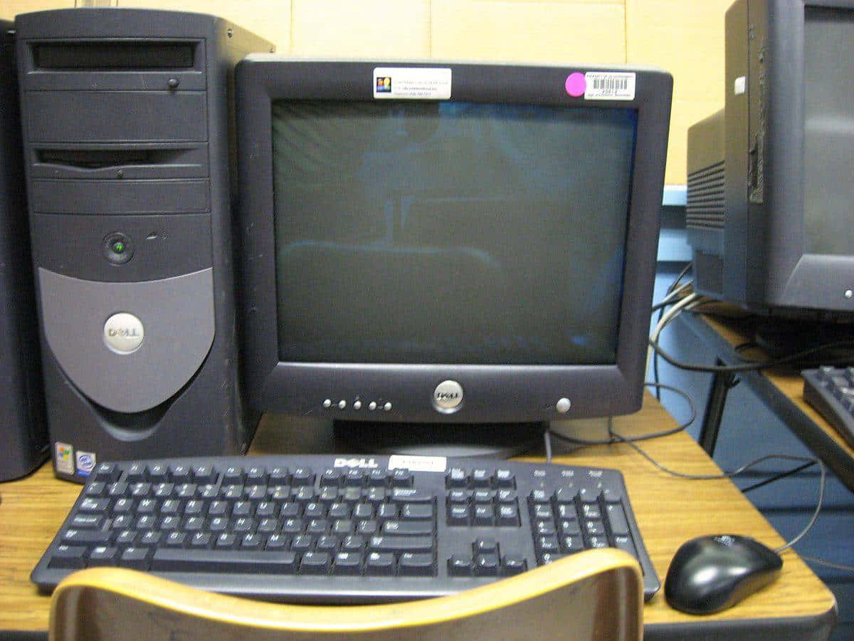 A Desk With A Computer Background