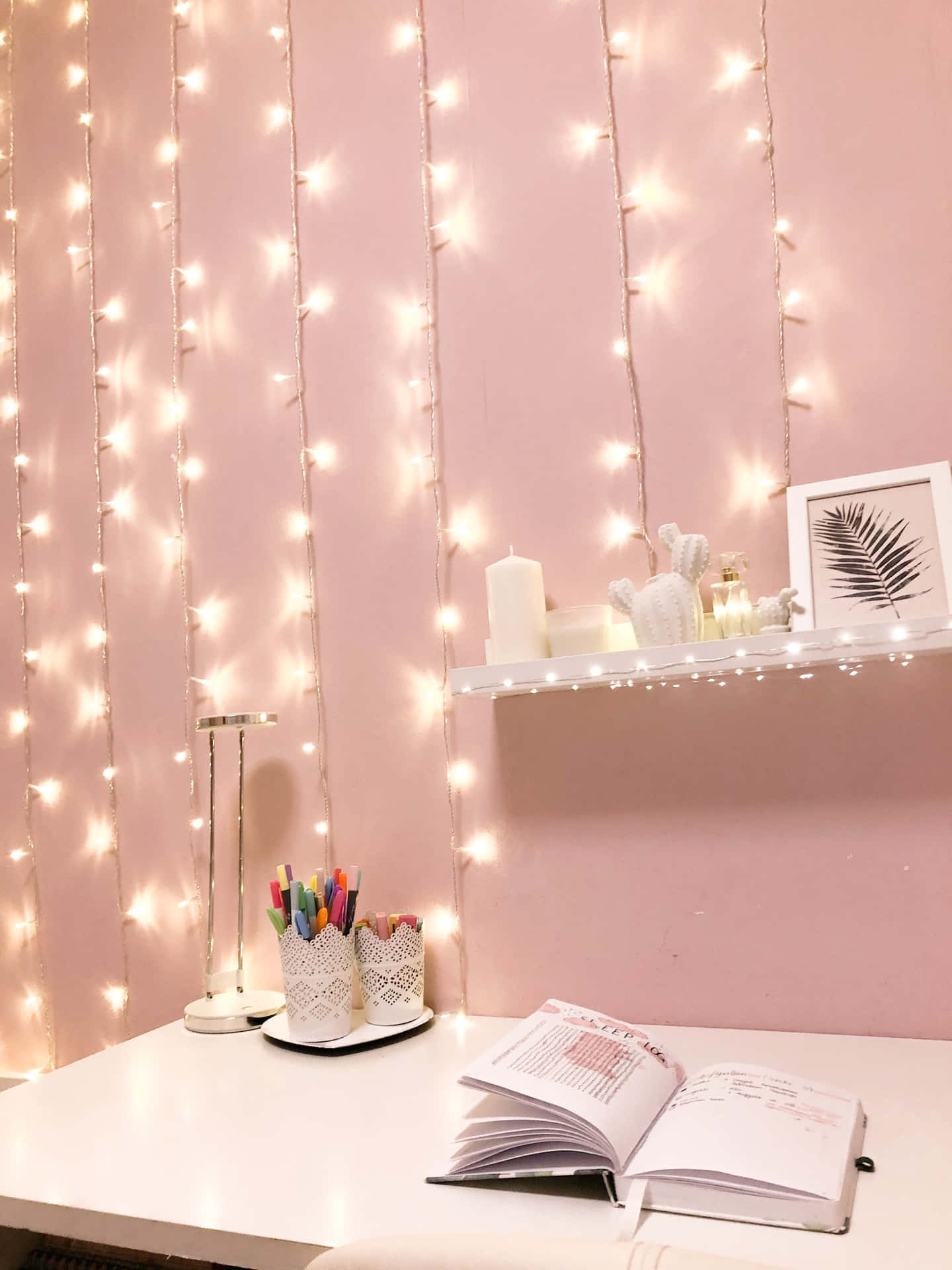 A Desk With A Lamp And Lights Hanging From It Background
