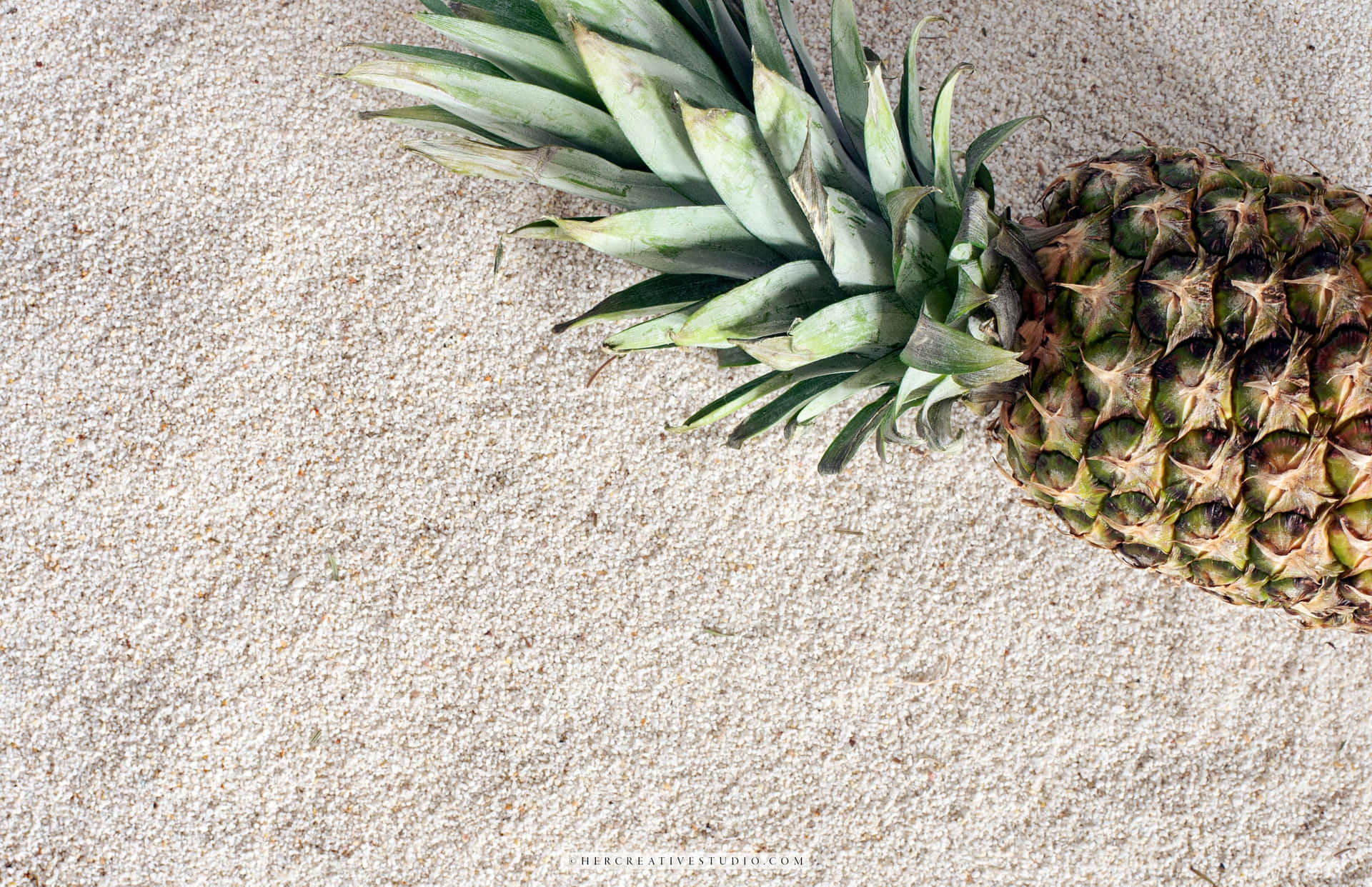 A Desktop Background Featuring A Ripe Pineapple On A Neutral Background Background