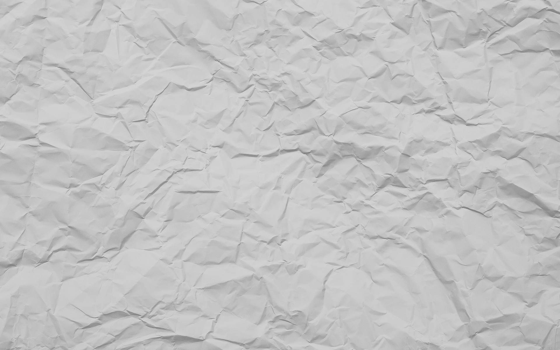 A Detailed Close-up Of White Crumpled Paper Texture Background