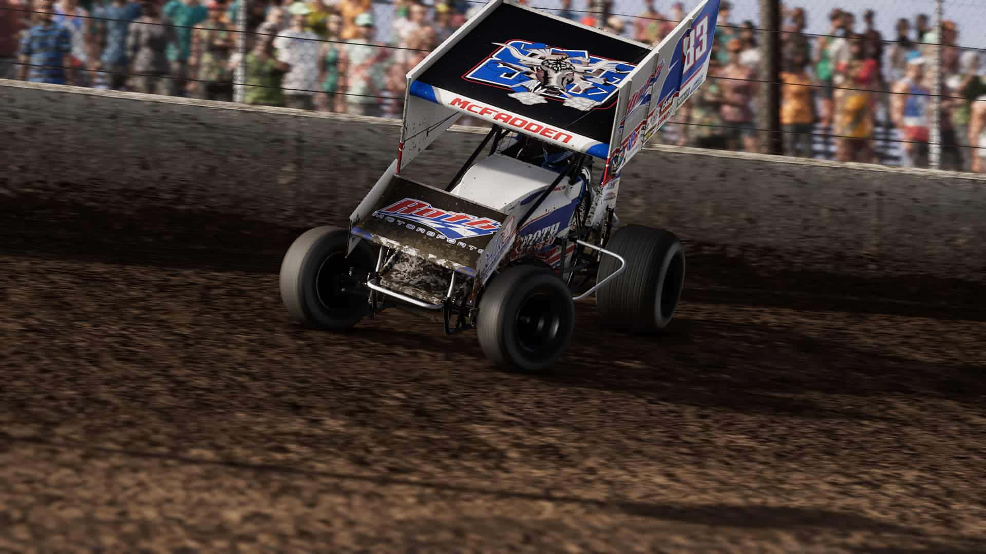 A Dirt Track Racer Driving In Front Of A Crowd Background