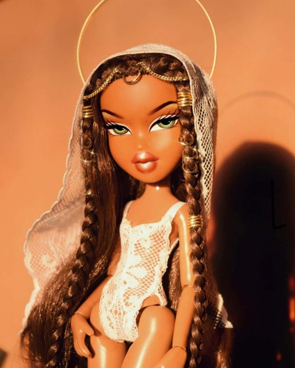 A Doll With Long Hair And A Lace Dress