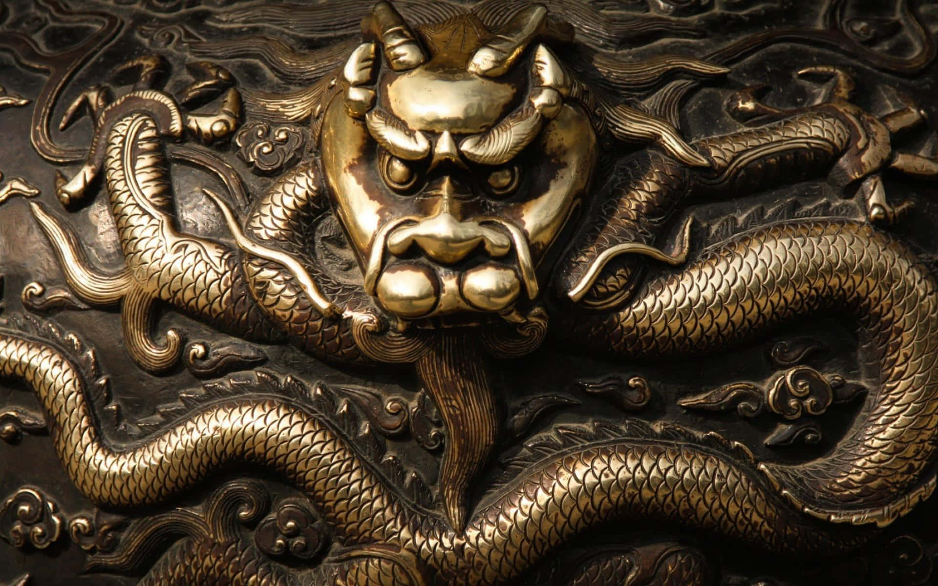 A Dragon Head On A Metal Object Background