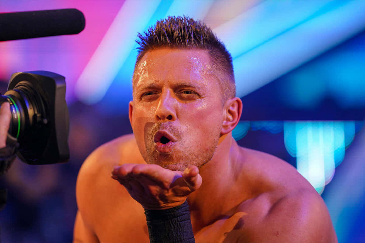 A Dynamic Picture Of The Miz, The Wrestling Legend, Blowing A Flying Kiss Background