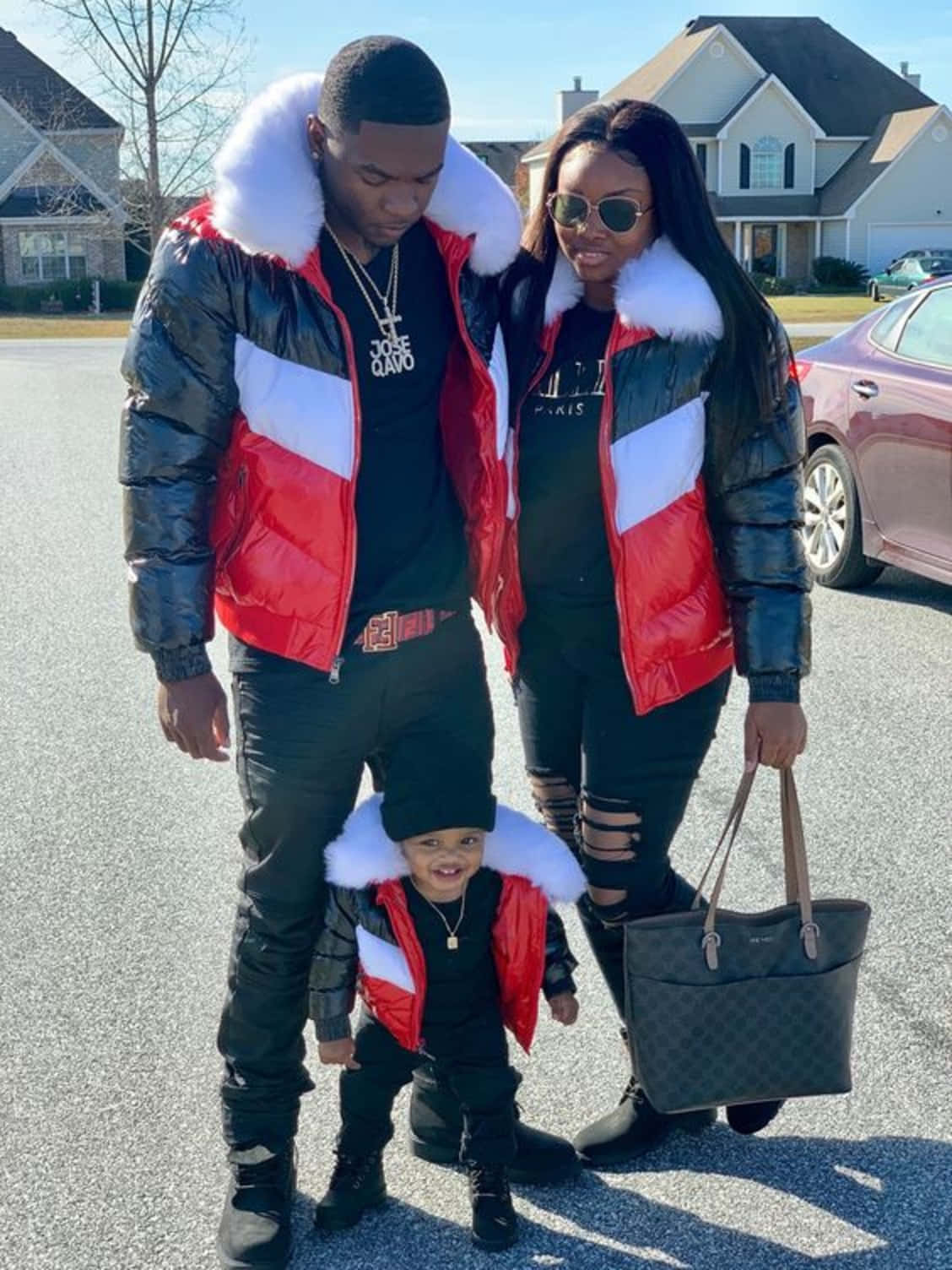 A Family In A Red, White And Black Jacket
