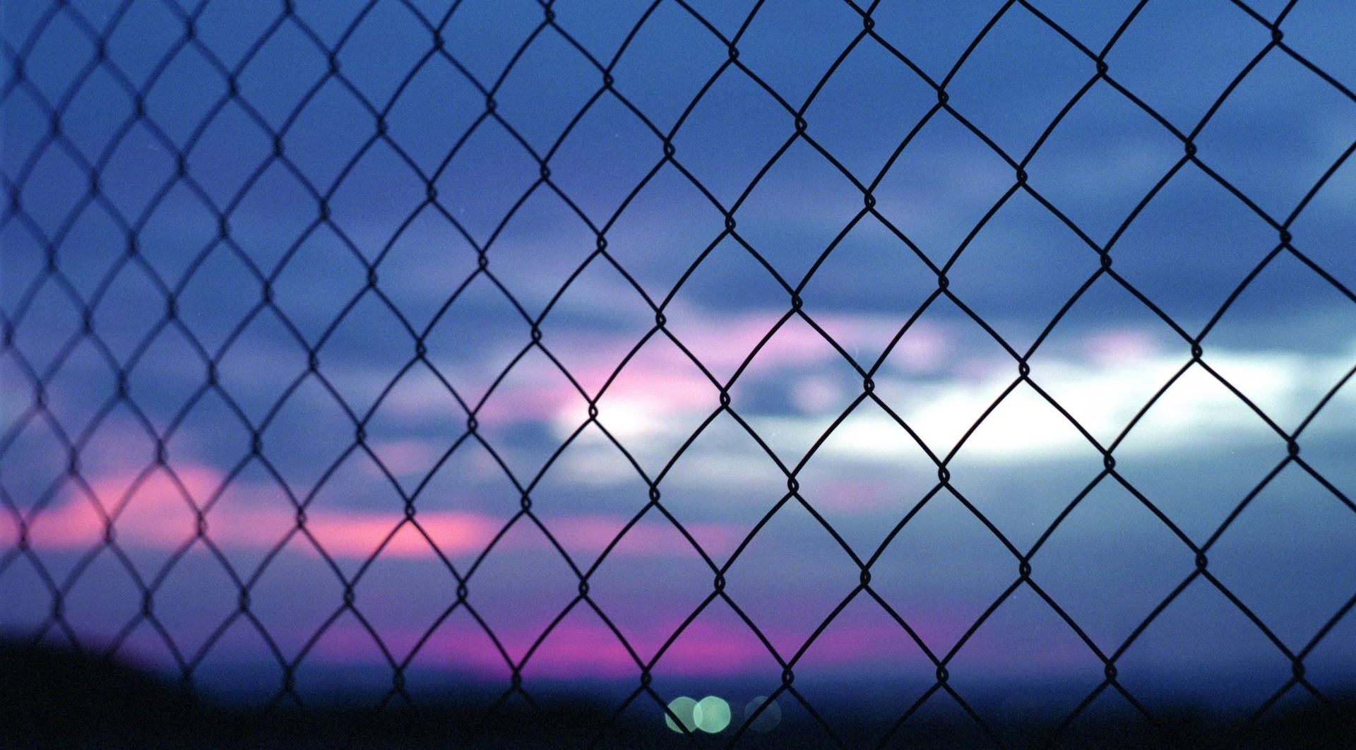 A Fence With A View Of The Sky Background