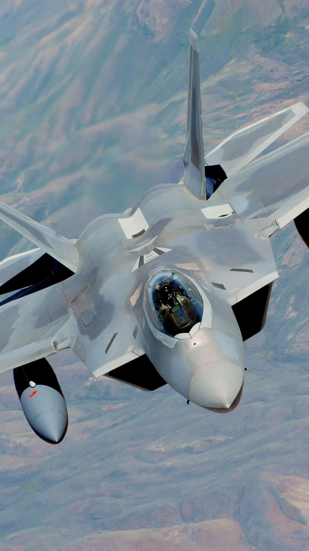 A Fighter Jet Flying In The Sky Background