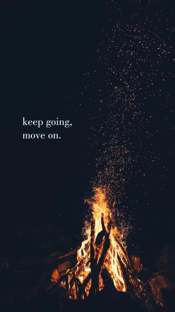 A Fire With The Words Keep Going, Move On Background