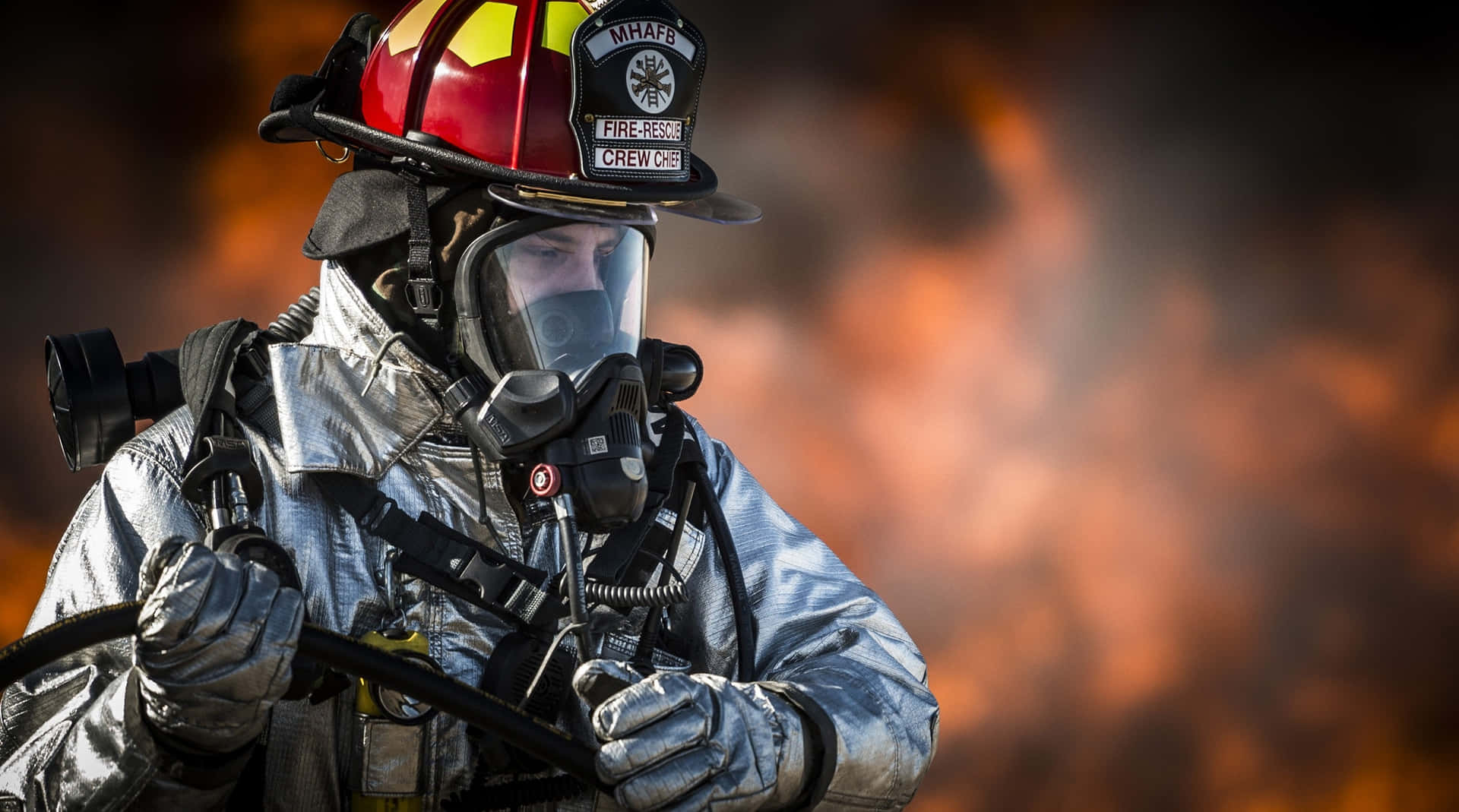 A Firefighter In A Firefighter Outfit Background