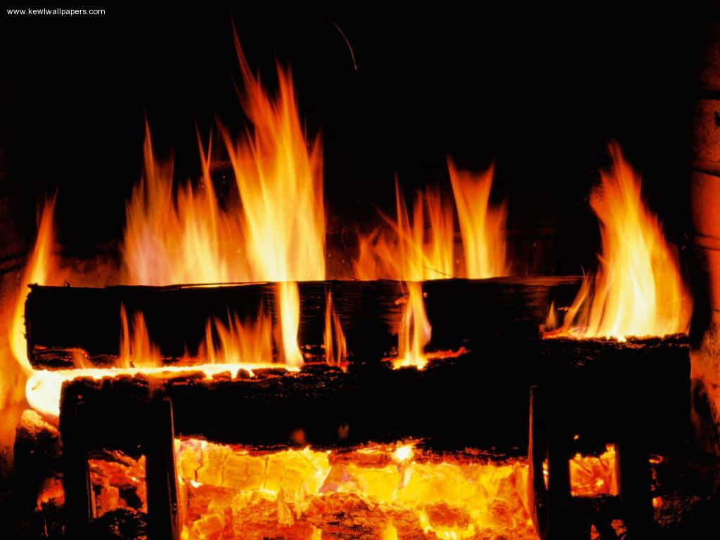 A Fireplace With Logs And Fire In It Background