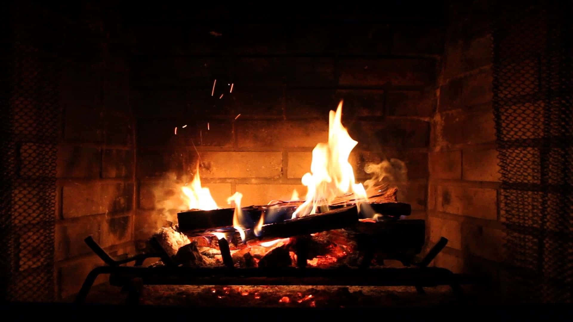 A Fireplace With Logs Burning In It Background