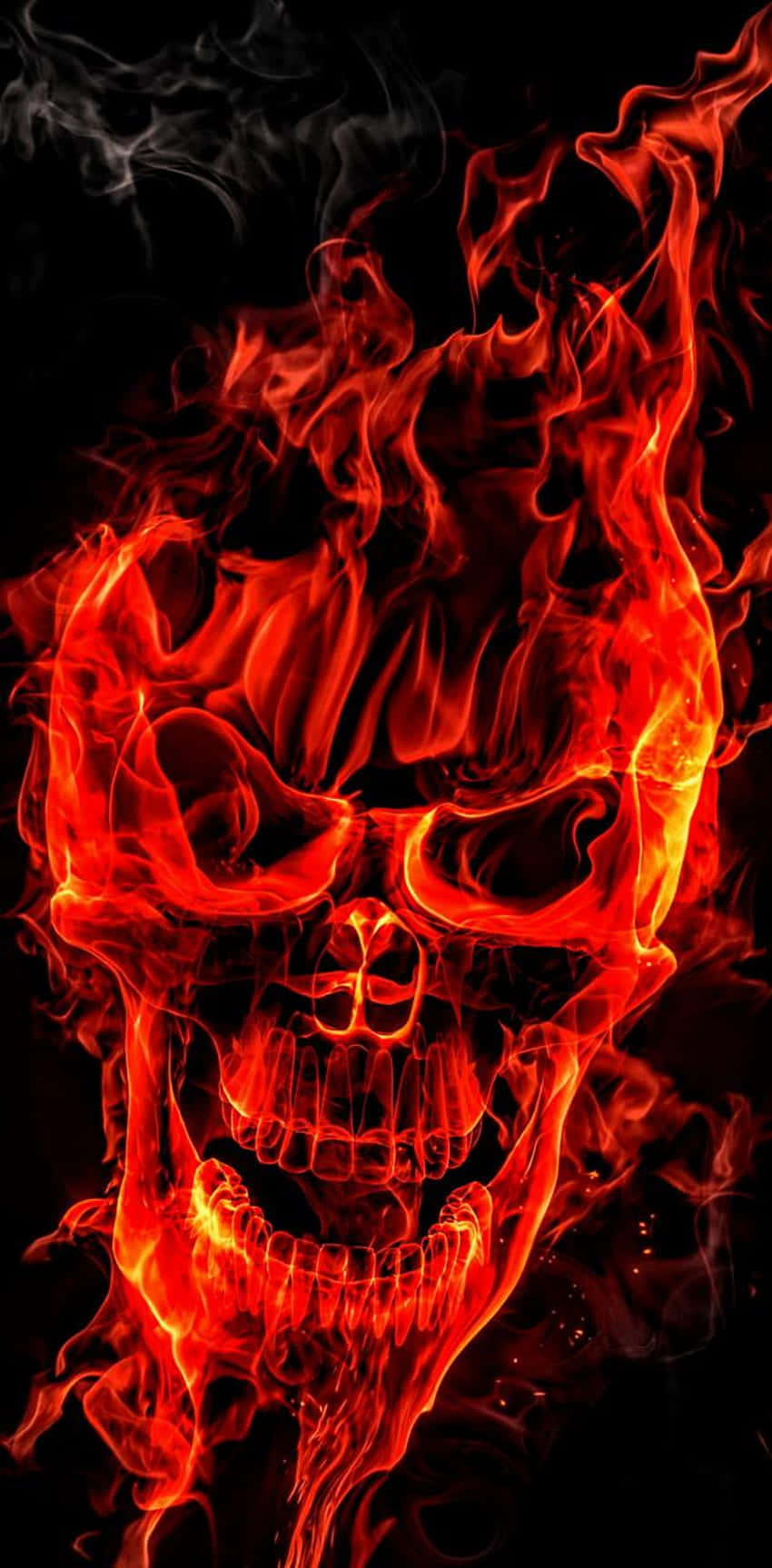 A Flaming Skull Fills The Dark With An Eerie Red Glow Background