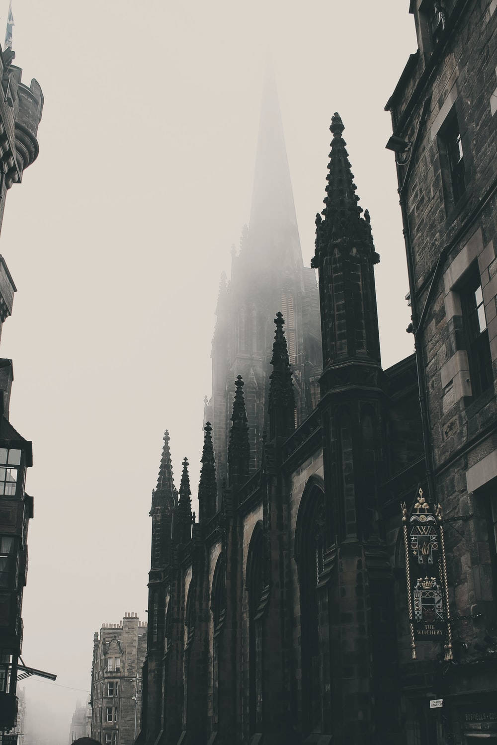 A Foggy Street With A Church In The Background