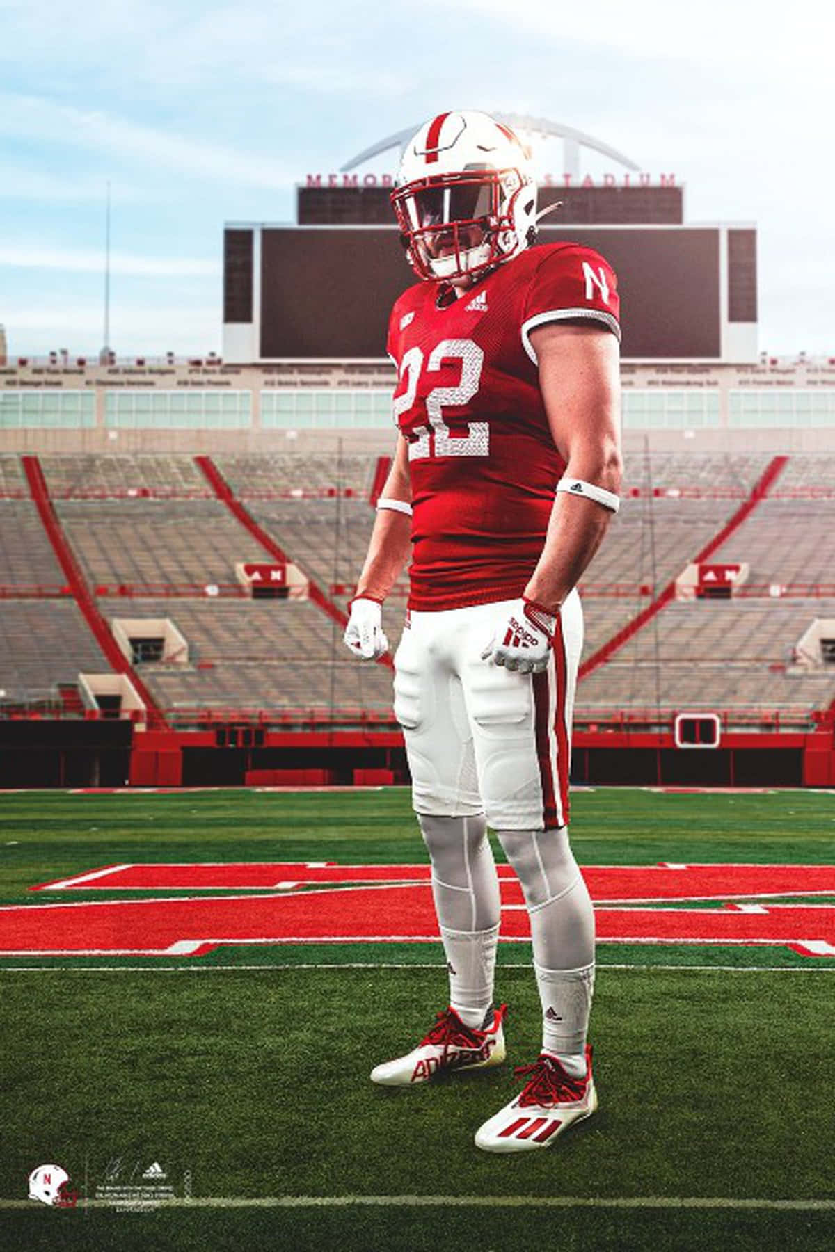 A Football Player Standing On A Field Background