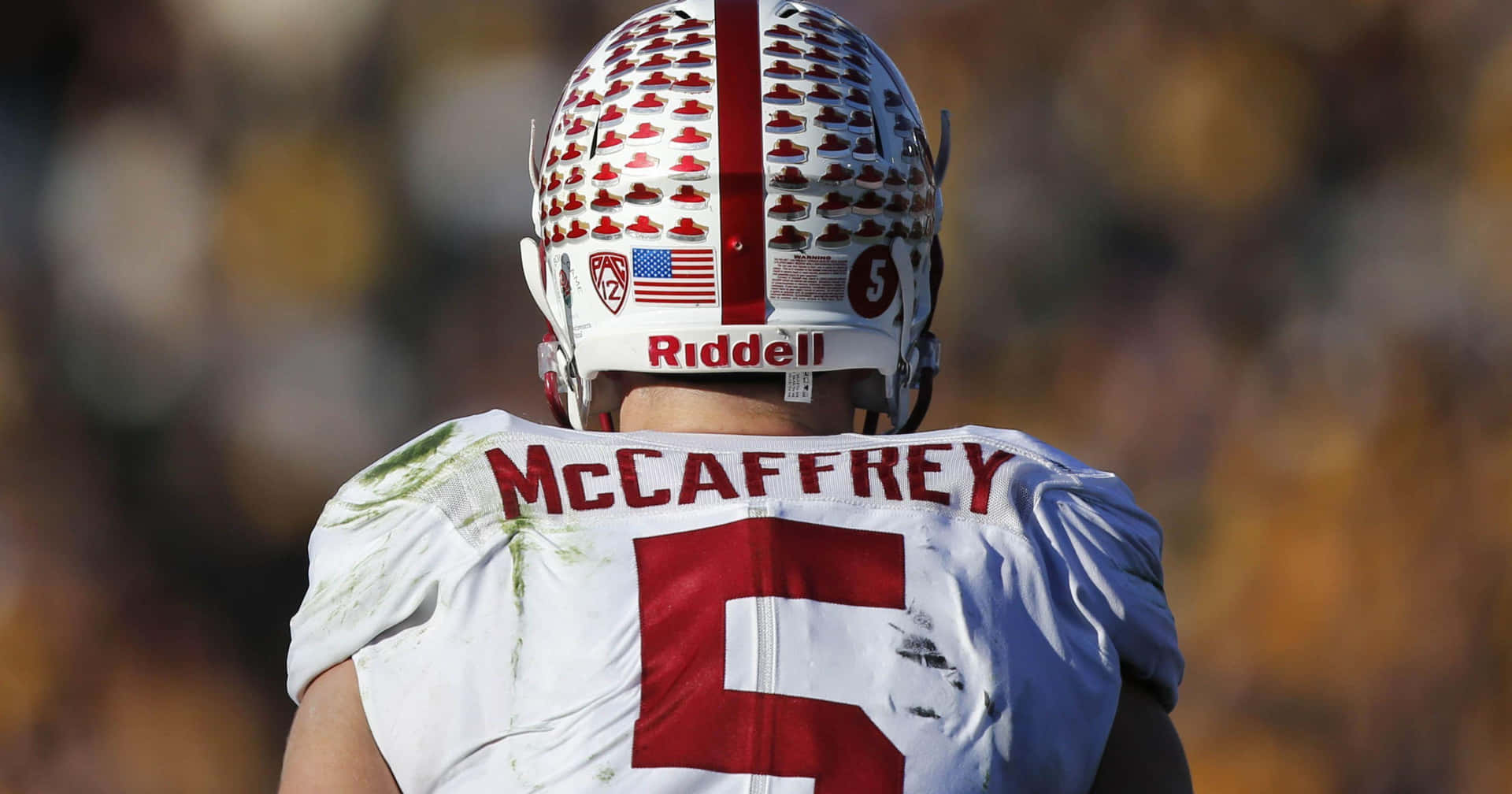 A Football Player Wearing A Helmet With The Number 7 On It Background