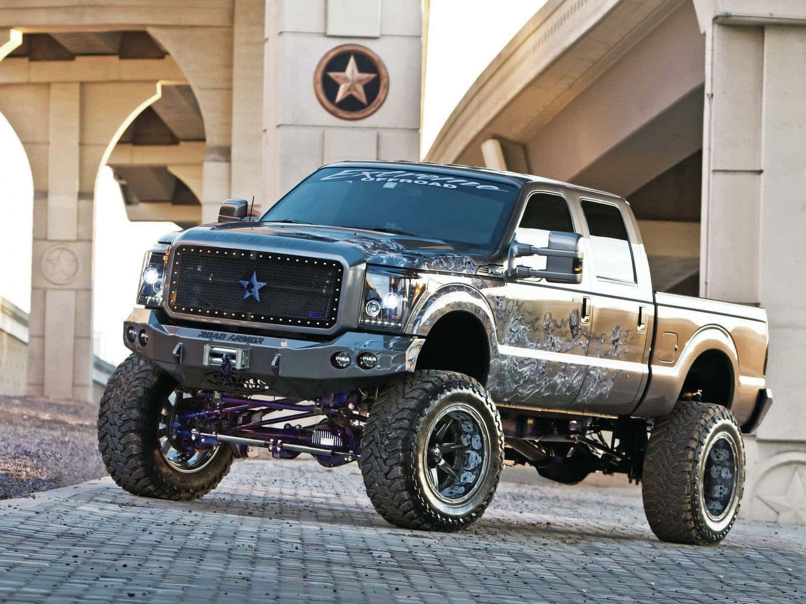 A Ford Super Duty Truck Is Parked On A Street Background