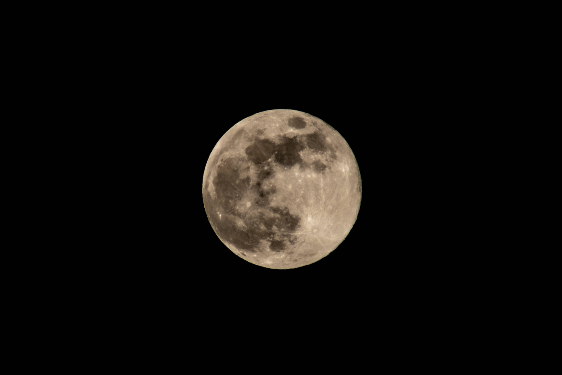 A Full Moon Is Seen In The Dark Sky Background
