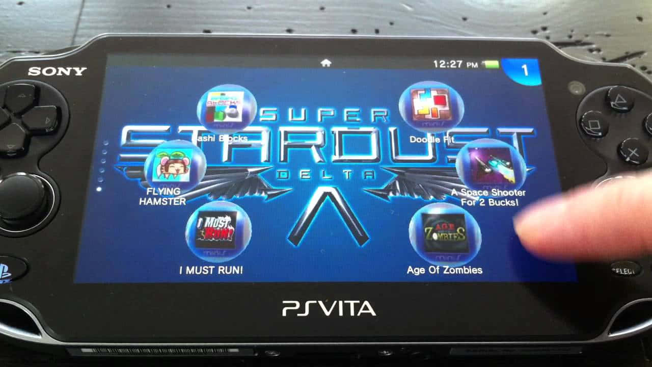 A Gamer Immersed In The World Of Ps Vita Background