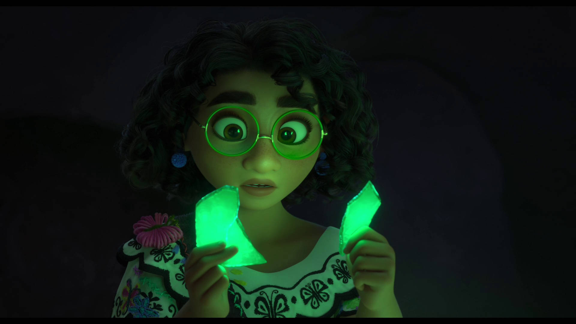 A Girl Holding A Glowing Green Crystal Background