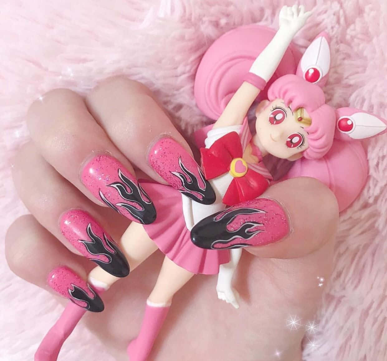 A Girl Holding A Pink Sailor Moon Doll Background