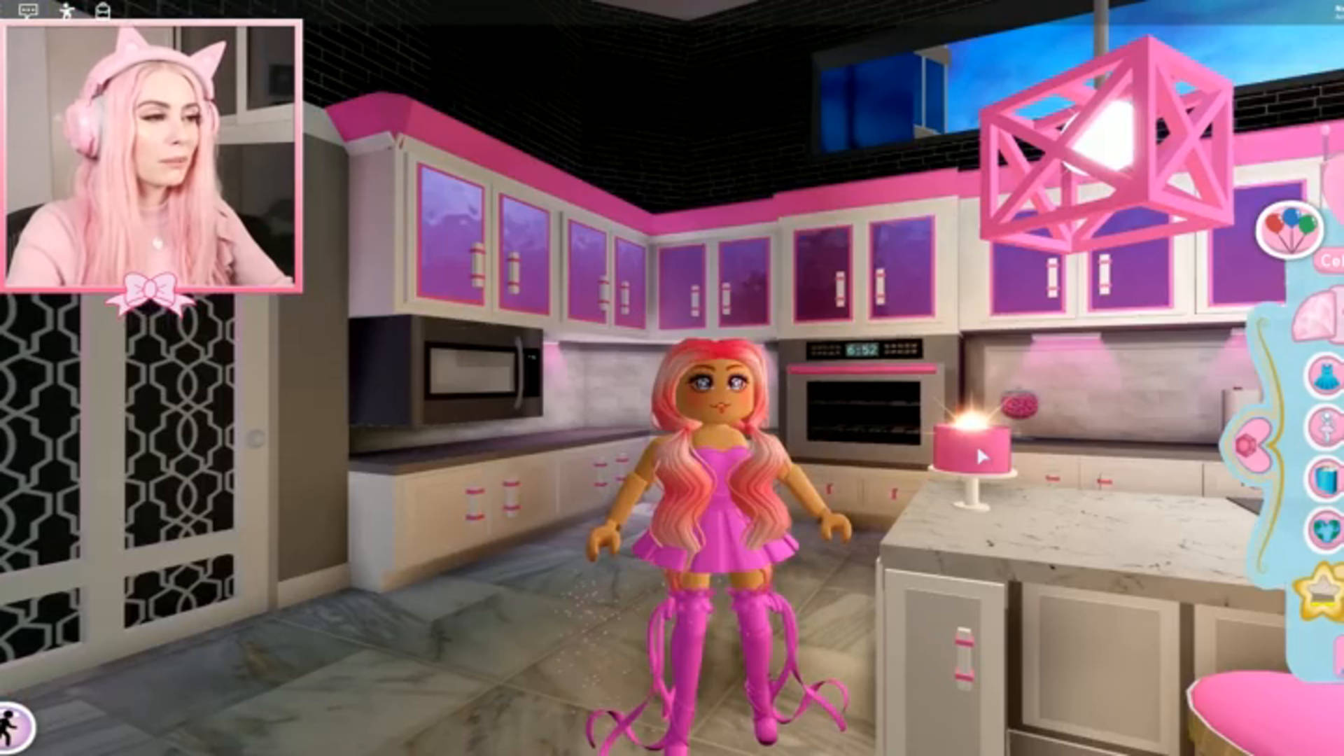 A Girl In A Pink Dress Is Standing In A Kitchen Background