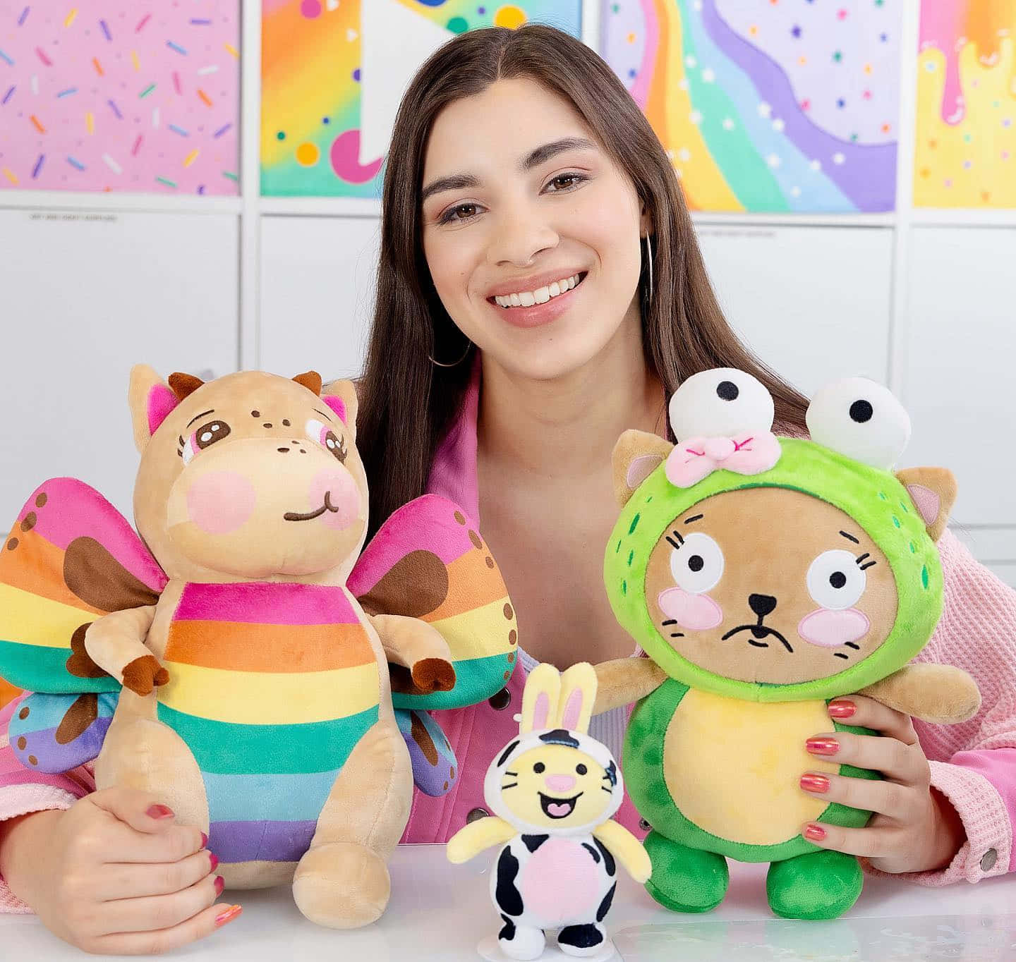 A Girl Is Holding Three Stuffed Animals Background