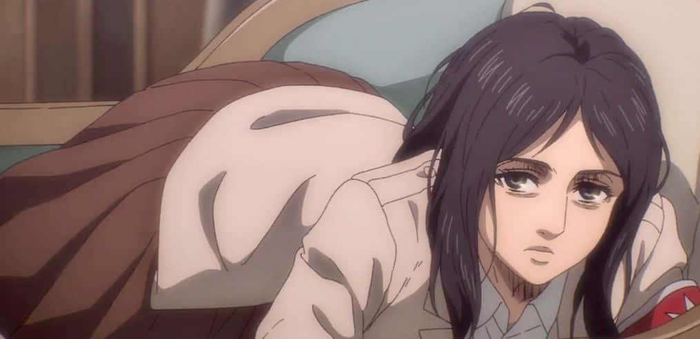 A Girl Is Laying On A Bed With Her Head Down Background