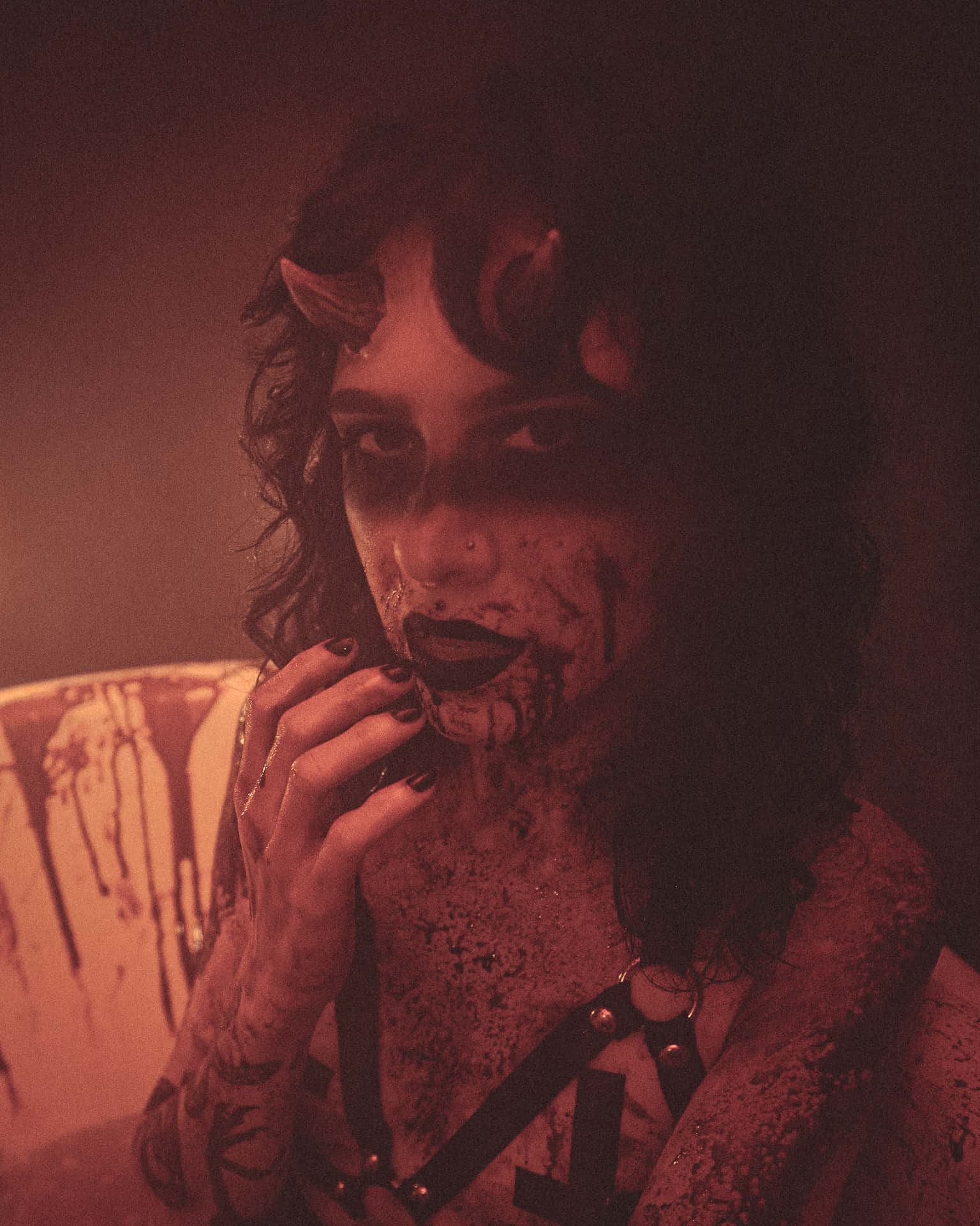 A Girl Stands With Devilish Strength And Ambition Background