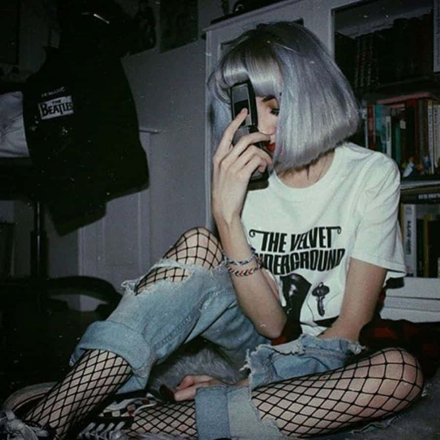 A Girl With Grey Hair And Fishnets Sitting On The Floor Background