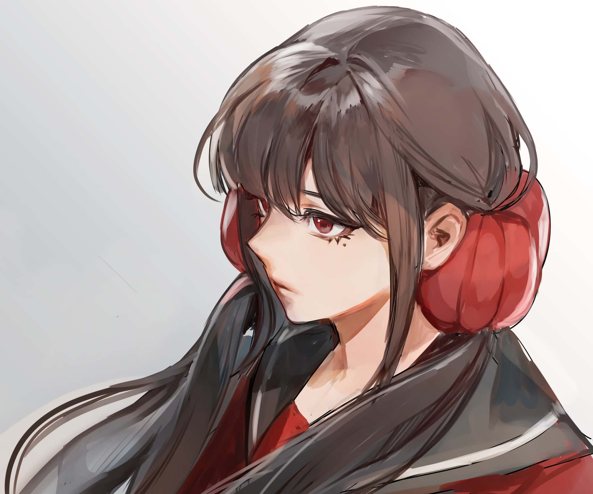 A Girl With Long Hair And Red Ear Muffs