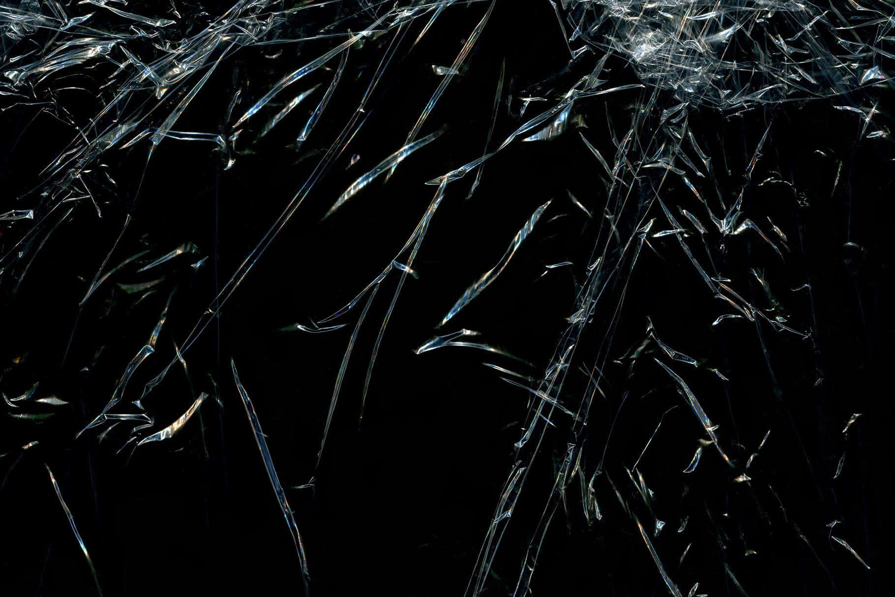 A Glass Window With A Broken Glass Background