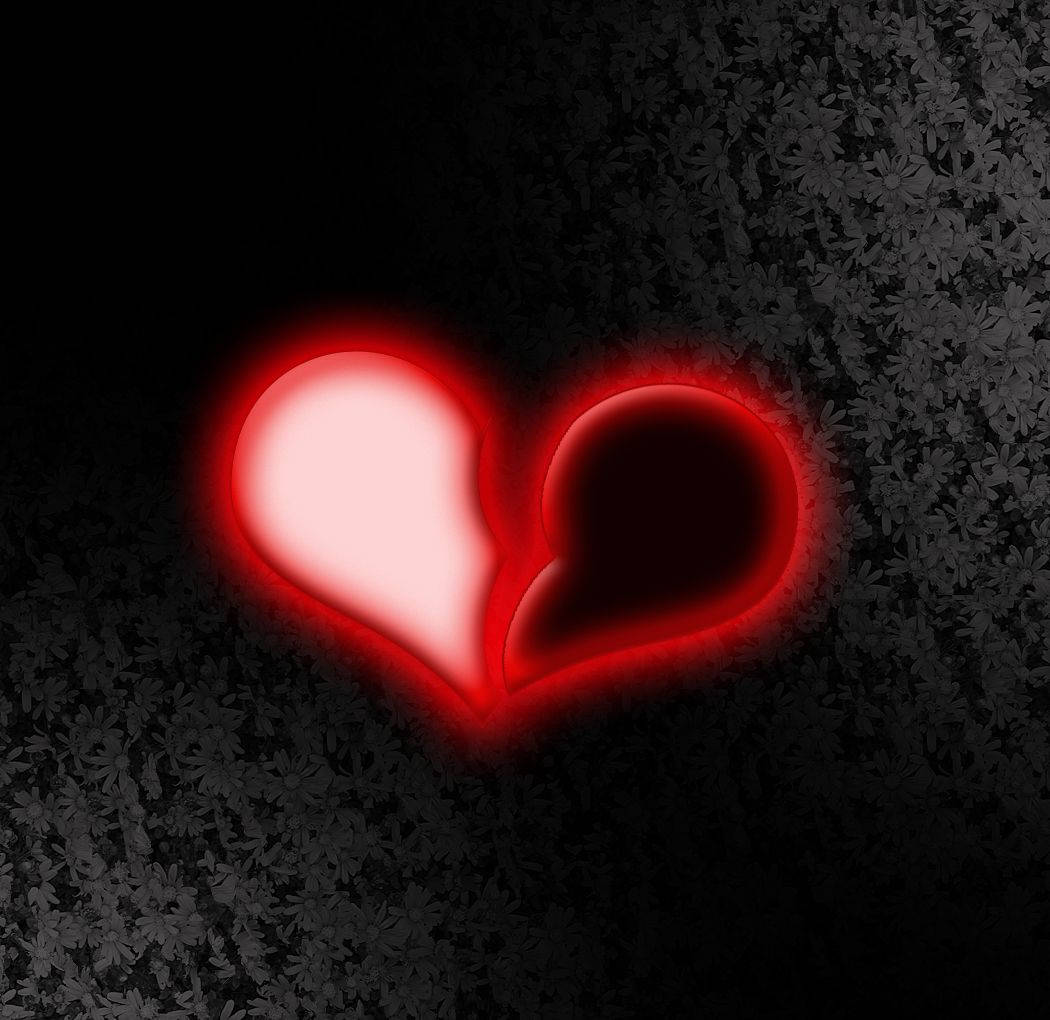 A Glowing Broken Heart In Monochrome Background