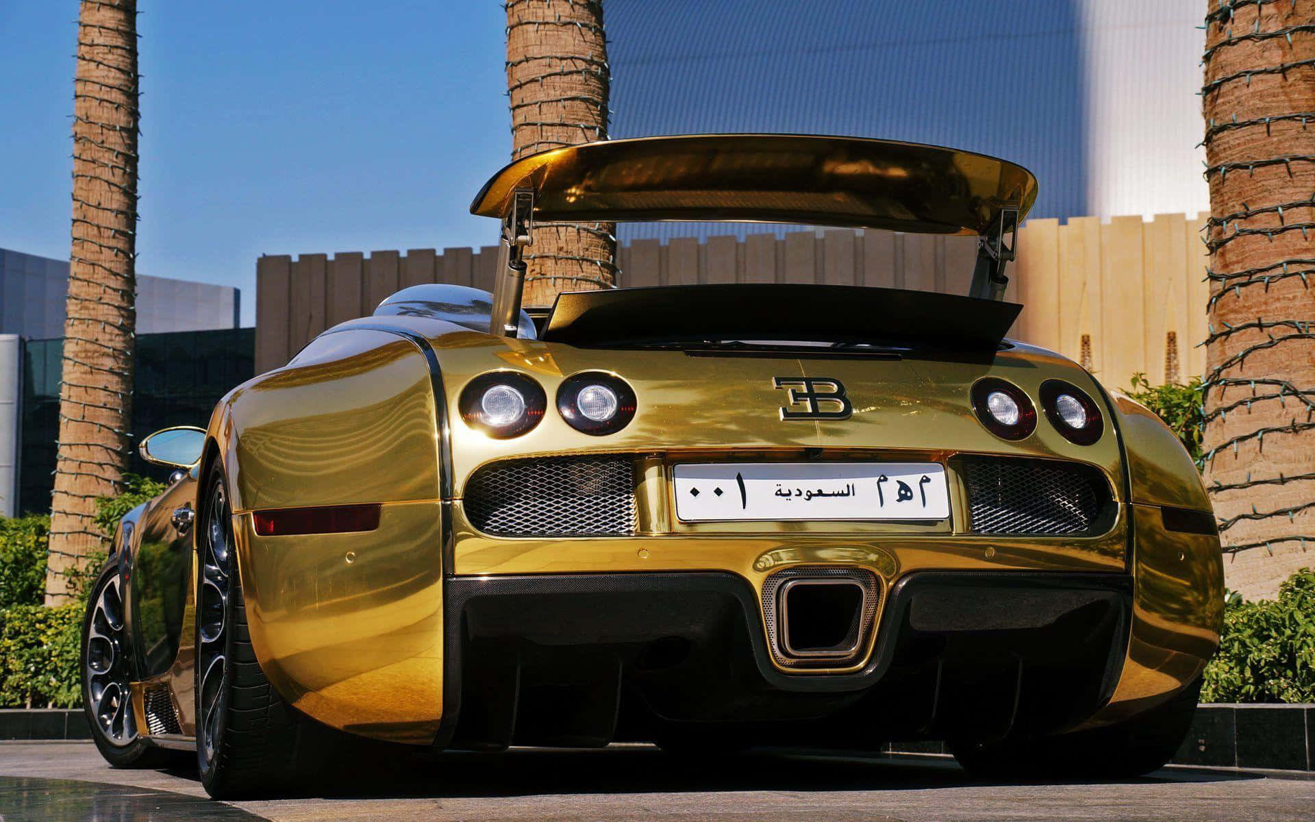 A Gold Bugatti Veyron Parked In Front Of Palm Trees Background