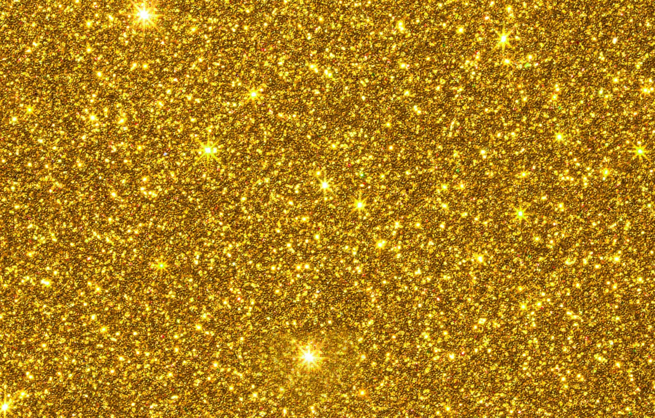 A Gold Glitter Background With Stars