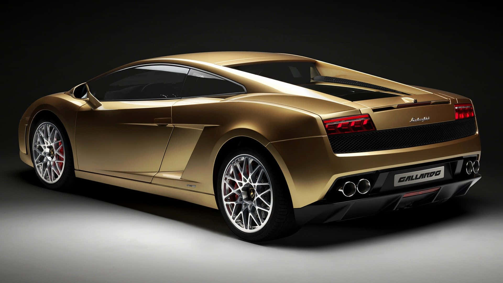 A Gold Lamborghini Parked At Sunset