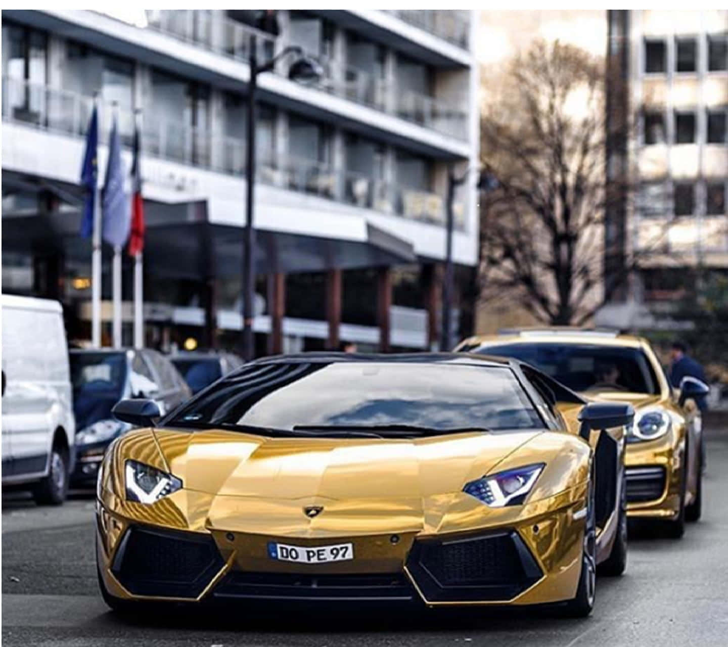 A Gold Lamborghini Parked On The Street
