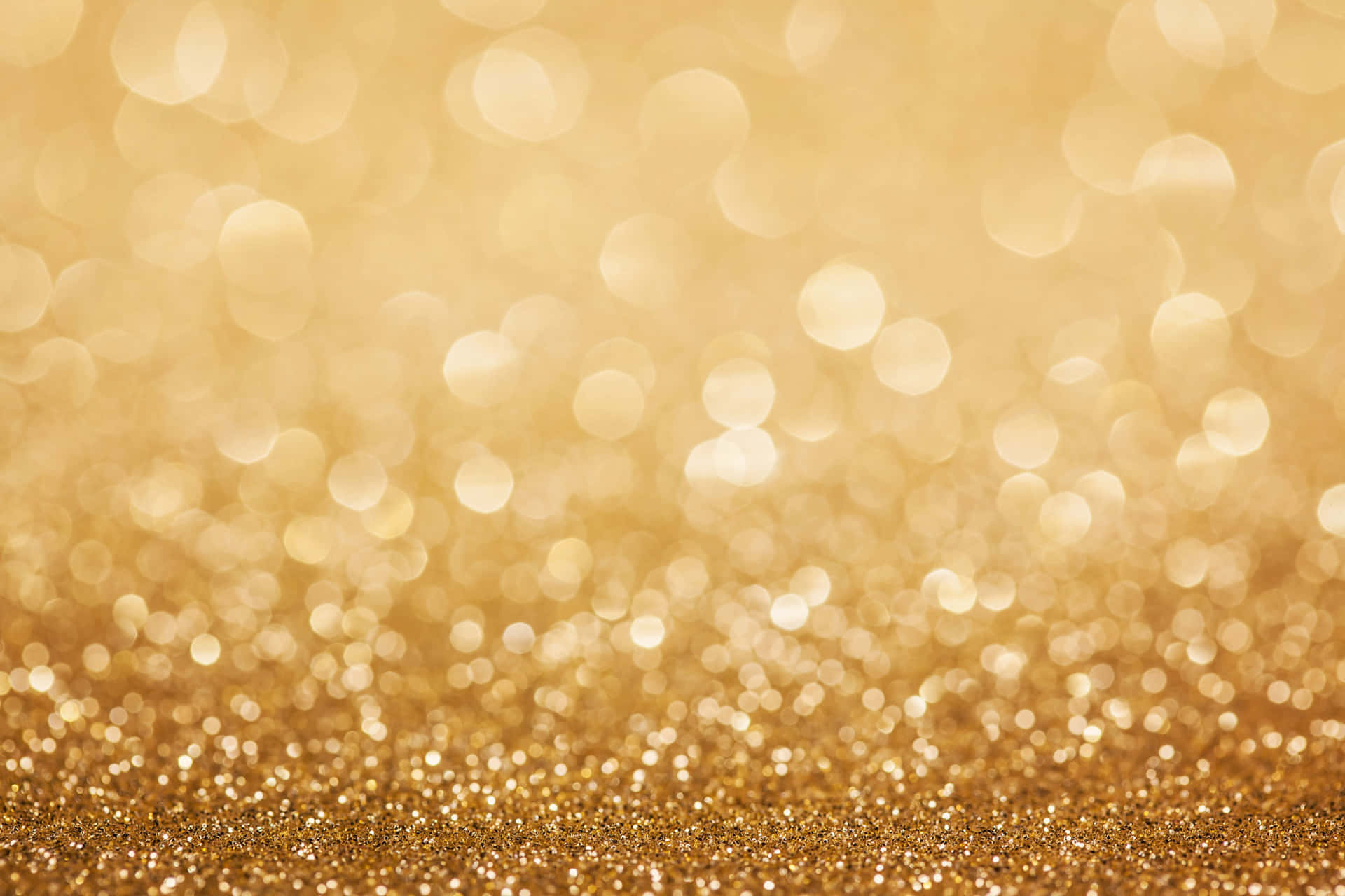 A Golden Glitter Background With Bokeh Background