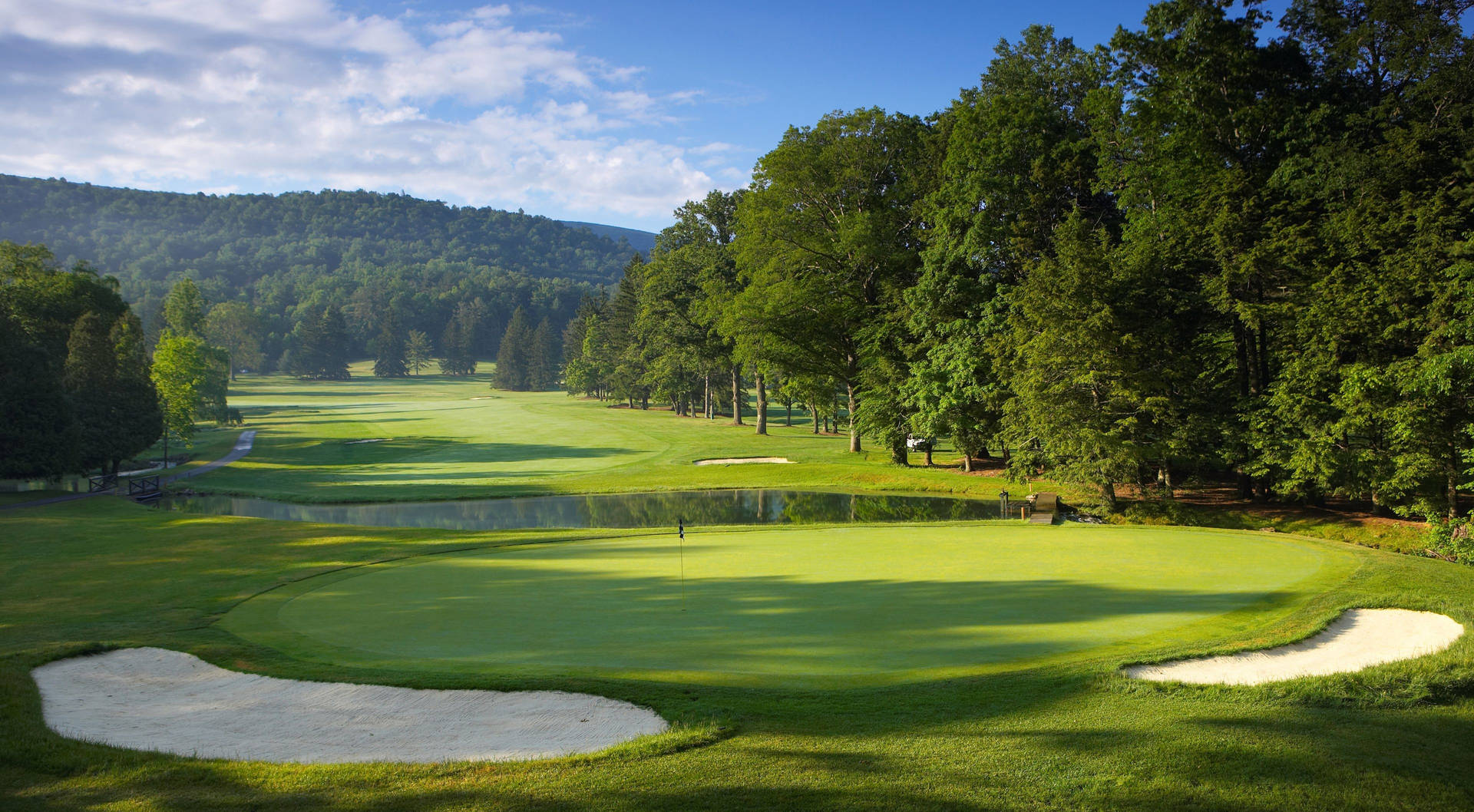 A Golf Course With Trees Background