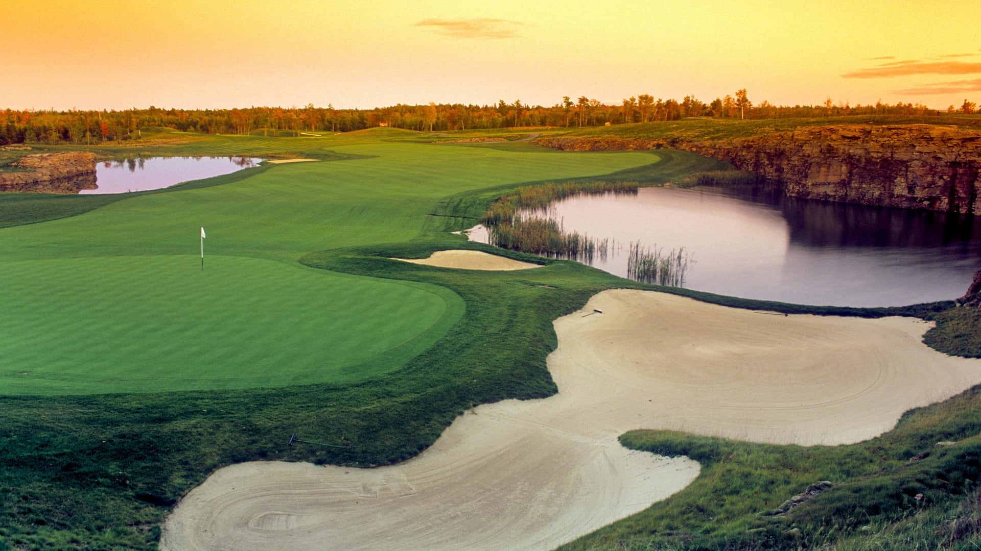A Golfer Focuses On Teeing Off In A Golf Course Background