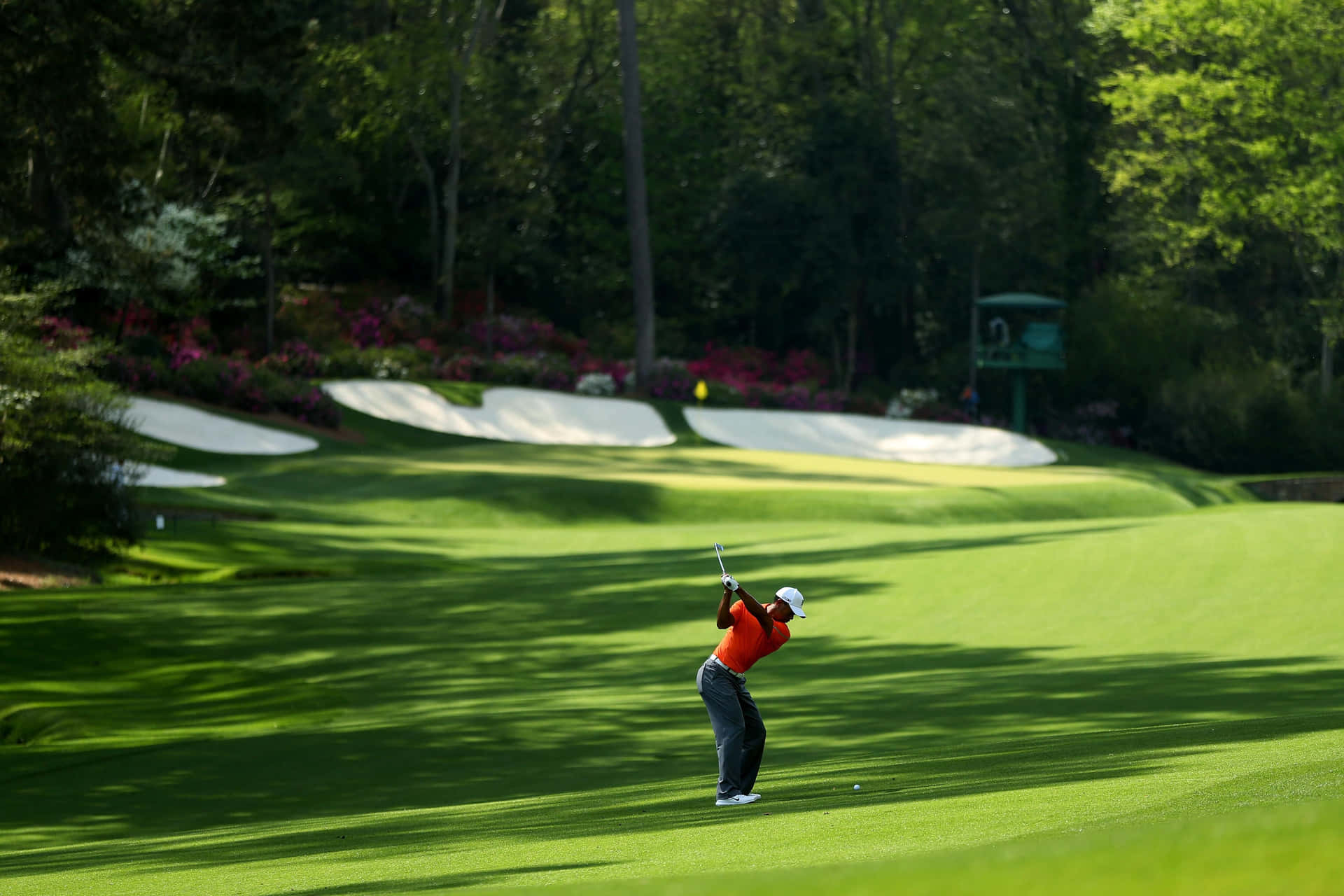 A Golfer Is Hitting A Ball On The Green Background