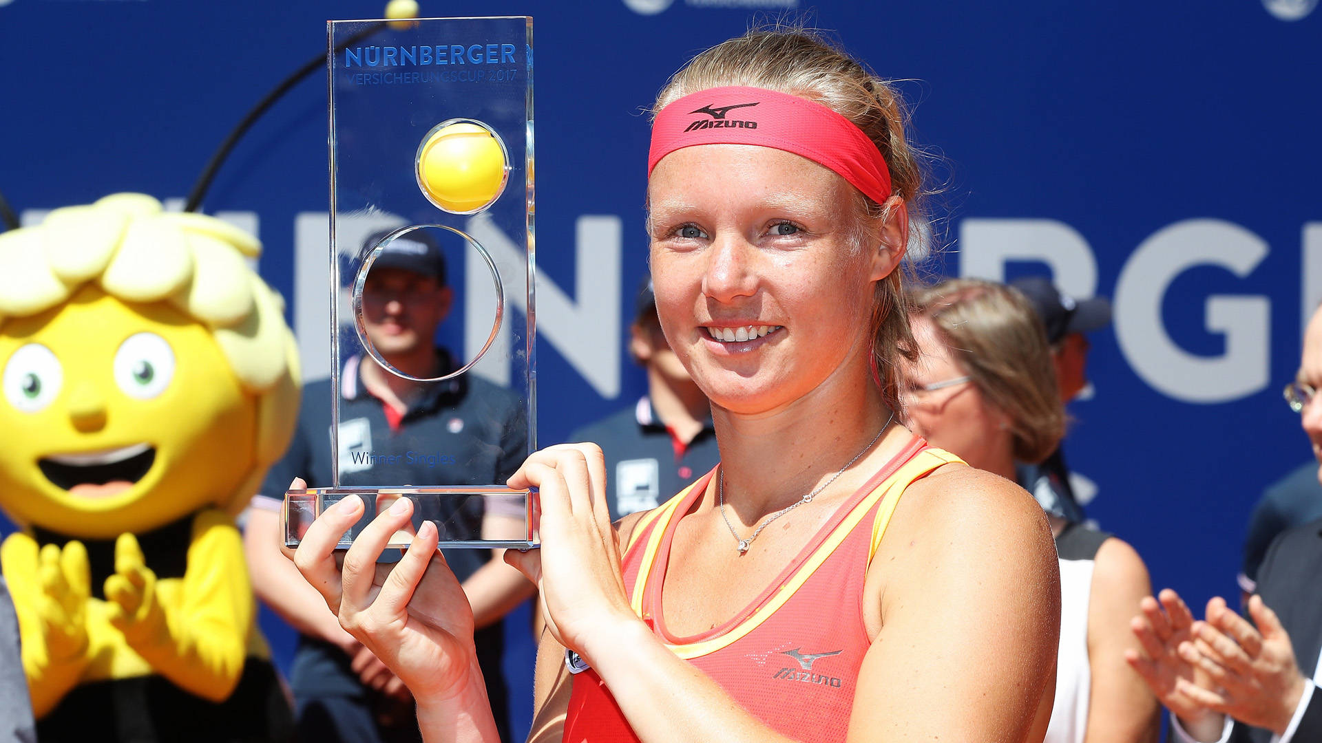 A Grand Victory - Kiki Bertens Proudly Poses With Trophy Background