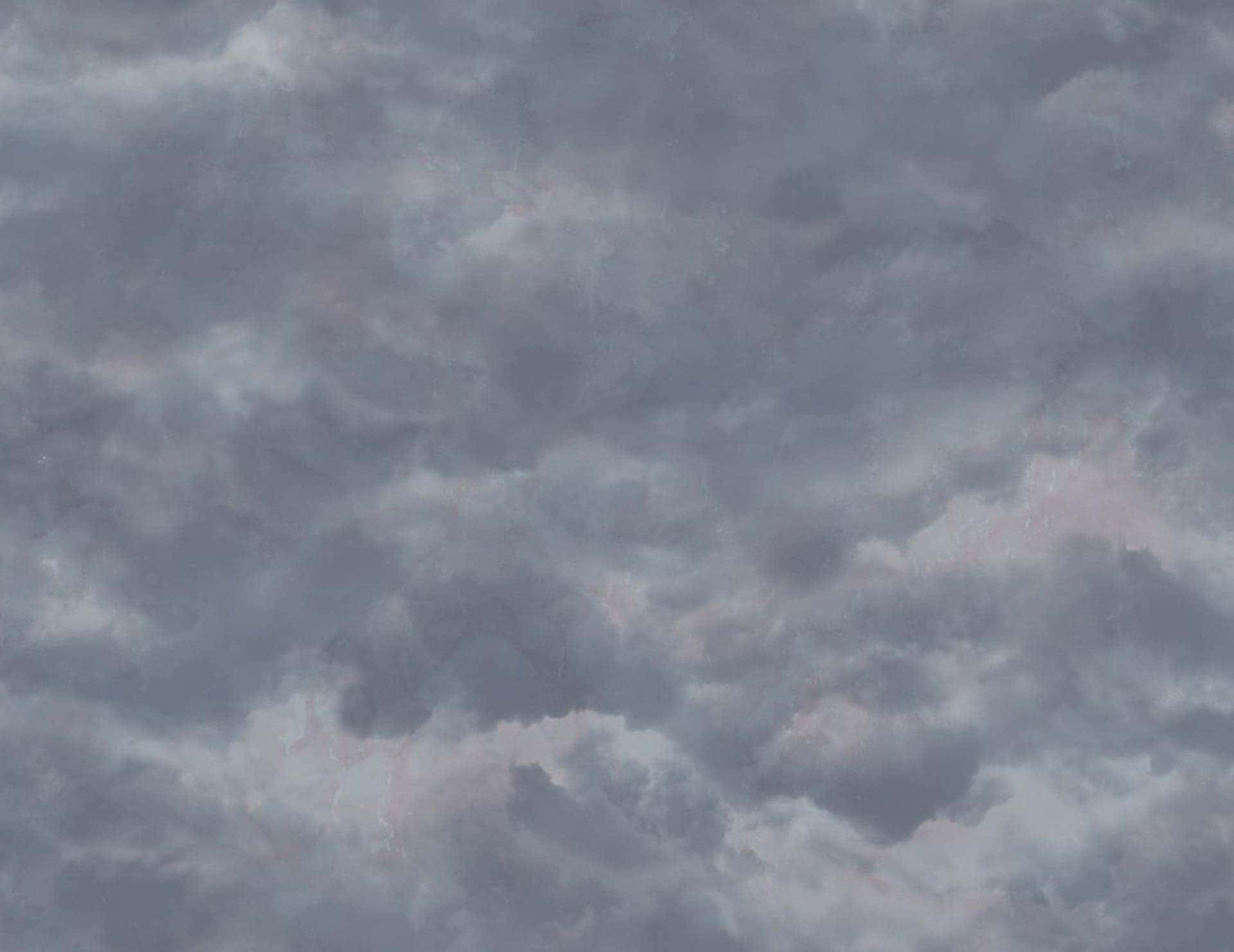 A Gray Sky With Clouds And A Few Clouds Background