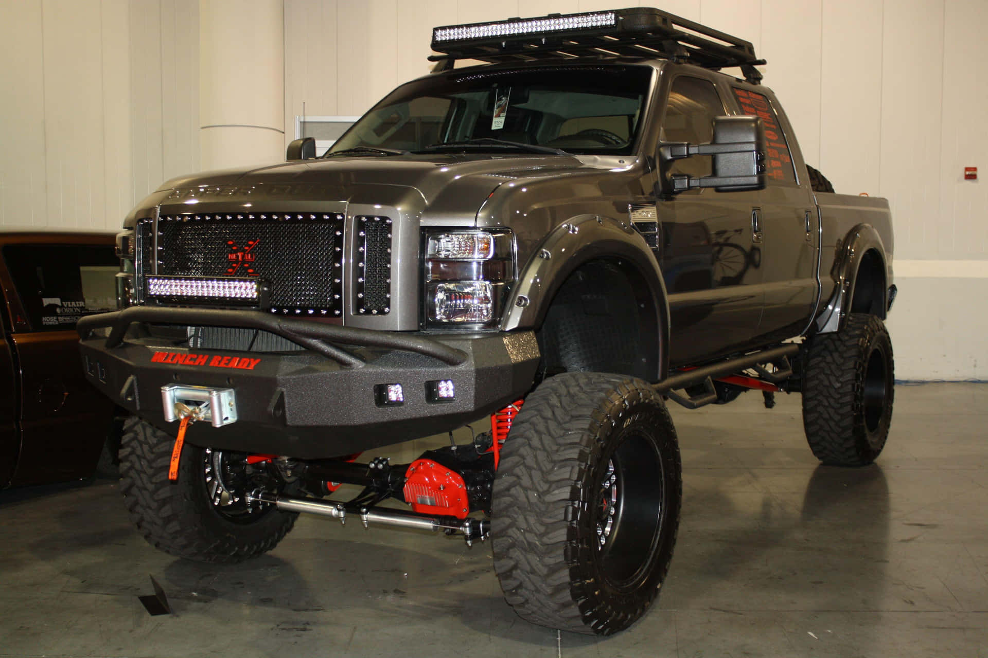 A Gray Truck With A Red Bed Liner