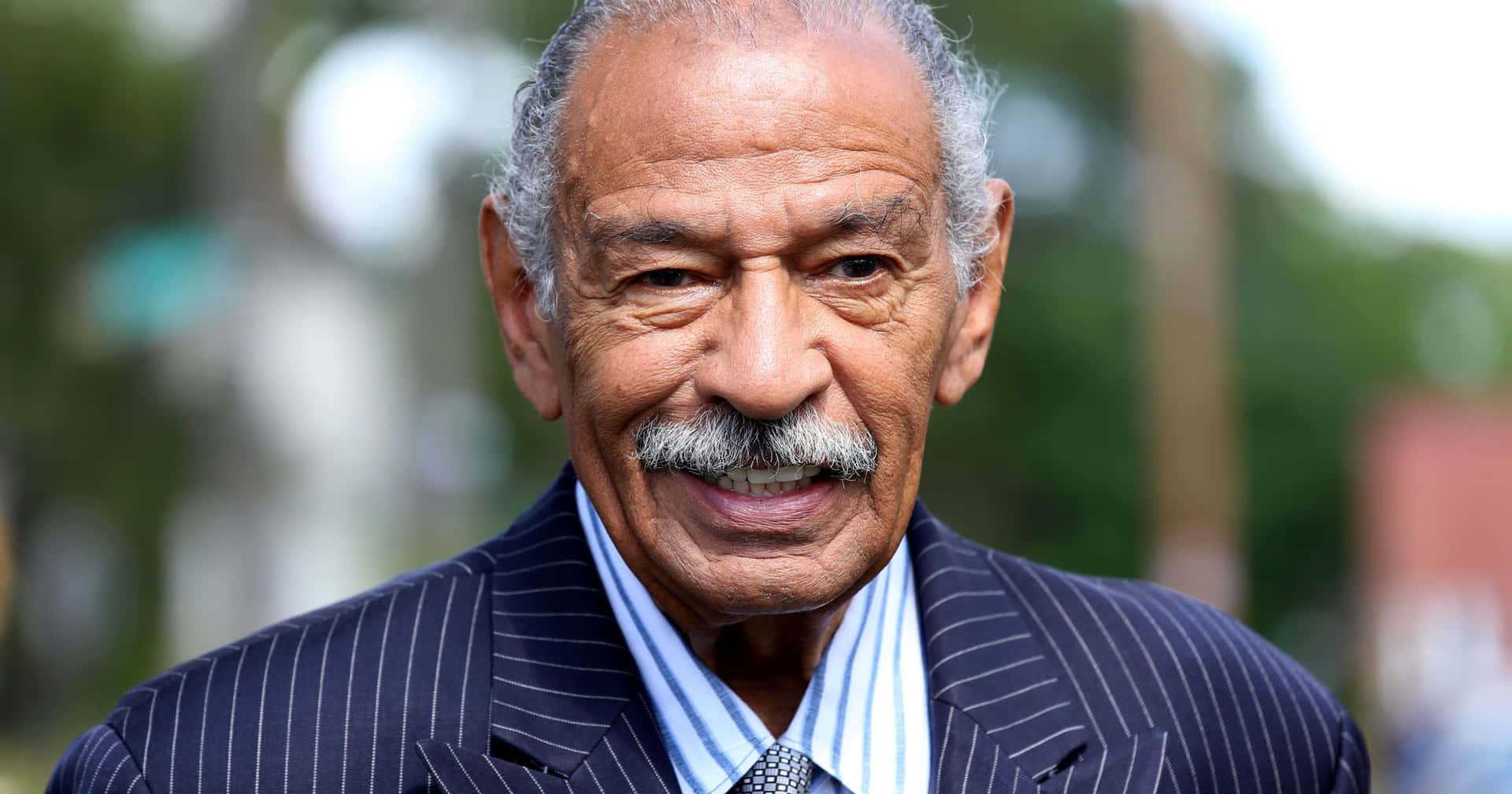 A Grayscale Portrait Of Former U.s Representative John Conyers Background