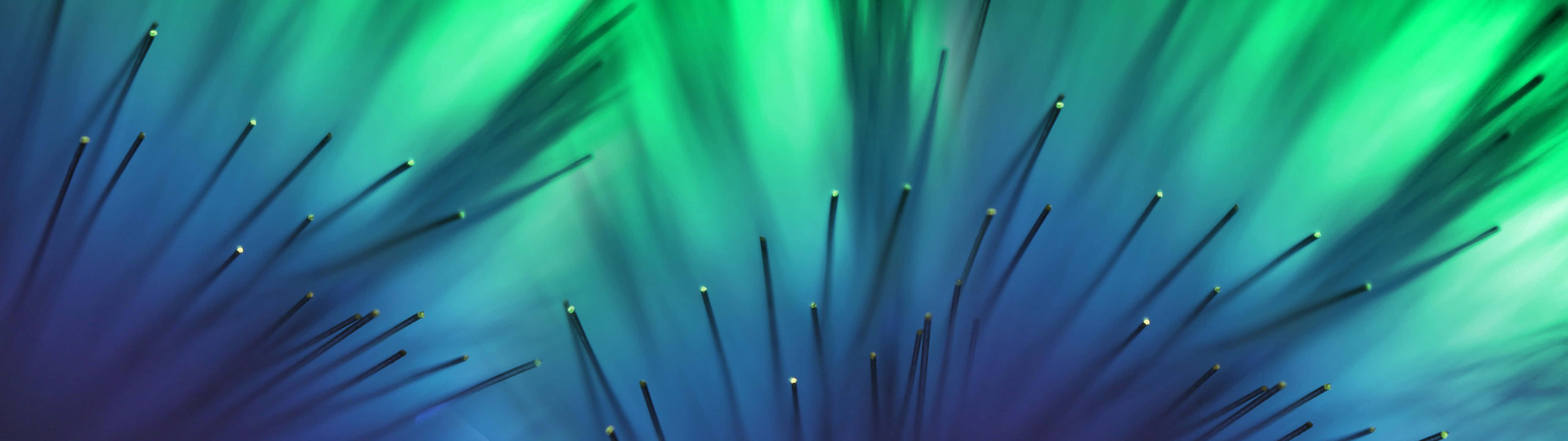 A Green And Blue Background With A Lot Of Spikes Background